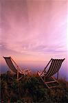 Deck Chairs by Shore near Cape Tryon Lighthouse at Sunrise Cape Tryon, Prince Edward Island Canada