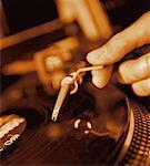 Close-Up of Hand Putting Needle On Record in Turn Table