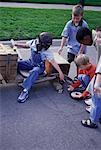 Group of Children Building Soapbox Car