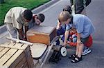 Group of Children Building Soapbox Car