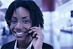 Portrait of Businesswoman Using Cell Phone, Smiling