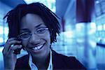 Portrait of Businesswoman Using Cell Phone, Smiling in Terminal