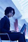 Portrait of Businesswoman Using Laptop Computer in Terminal