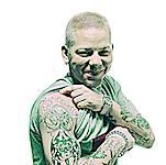 Portrait of Man Lifting Sleeve To Show Tattoo on Arm
