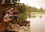 Grandfather, Father and Son Fishing from Rocks Belgrade Lakes, Maine, USA