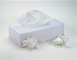 Box of Tissues with Bunched Up Used Tissues