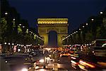 Arc de Triomphe and Traffic on Street at Night Paris, France