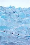 Group of People Ice Climbing Mendenhal Glacier, near Juneau Alaska, USA