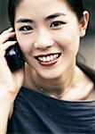 POrtrait of Woman Using Cell Phone, Smiling