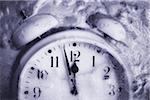 Close-Up of Alarm Clock Frozen In Ice