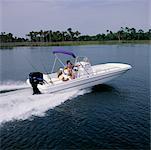 Three People in Cruising Boat Bay Area, Florida, USA