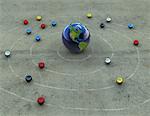 Globe and Orbiting Spheres as Marbles on Ground North and South America