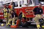 Group of Firefighters by Fire Engine