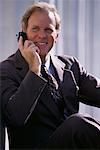 Portrait of Mature Businessman Using Cell Phone Outdoors