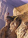 Mountain Climber Overlooking Canadian Rockies at Sunrise Canmore, Alberta, Canada