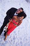 Portrait of Couple in Formal Wear On Beach