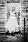 Portrait of Woman in Dress Standing in Front of Doorway Laughing