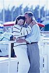 Mature Couple Embracing at Marina