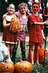 Group Portrait of Children in Halloween Costumes Outdoors