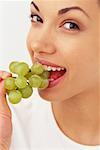 Portrait of Woman Eating Grapes