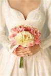 Close-Up of Bride Holding Bouquet Of Flowers