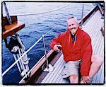 Portrait of Mature Man on Sailboat, Holding Glass of Wine