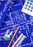 Keys, Pencil, Calculator and Ruler on Blueprints