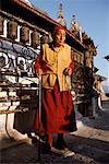 Mature Buddhist Monk Holding Mani Beads at Swayambhunath Stupa Kathmandu, Nepal