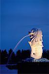 Merlion Statue Spouting Water At Night Singapore