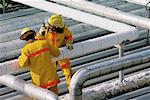 Firefighters Performing Inspection at Oil Refinery