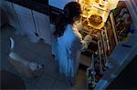 Woman Standing at Fridge, Having Chicken as Midnight Snack