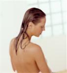 Blurred View of Woman with Wet Hair, Wrapped in Towel