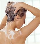 Back View of Woman Washing Hair