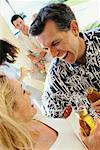 Couple with Drinks, Talking Outdoors