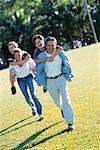 Family having Piggy-Back Race