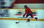 Blurred View of Young Man Playing Hockey