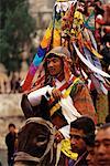 Homme à cheval au Bhoutan Festival Punakha Dromche