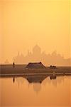 Silhouette of Taj Mahal in Haze At Sunset Agra, India