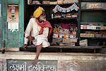 Mature Man Sitting in Shop Window Pushkar, Rajasthan, India