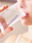 Close-Up of Woman Drinking Glass Of Water