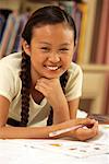 Portrait of Girl on Bed with Homework