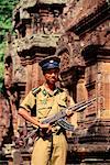 Portrait of Officer with Gun at Banteay Srei Temple Siem Reap, Cambodia