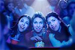 Three Girls Watching Movie in Theatre, Smiling