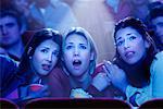 Three Girls Watching Movie in Theatre