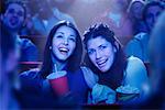 Two Girls Watching Movie in Theatre, Laughing