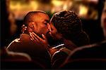 Couple Kissing in Movie Theatre