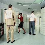 Businesswoman and Businessmen in Office with Targets