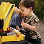 Child Fixing Car