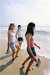 Teens Walking on Beach