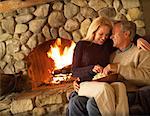 Mature Couple by Fireplace